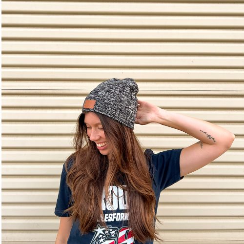 Model wearing the Knit Beanie with Leather Debossed R2R Tag