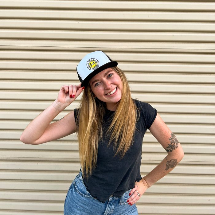 Model wearing Moto-Smiley Trucker Hat